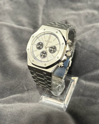 Silver watch on a gray textured background